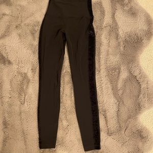 Lululemon black leggings size 4. High waisted with velvet stripe down side.